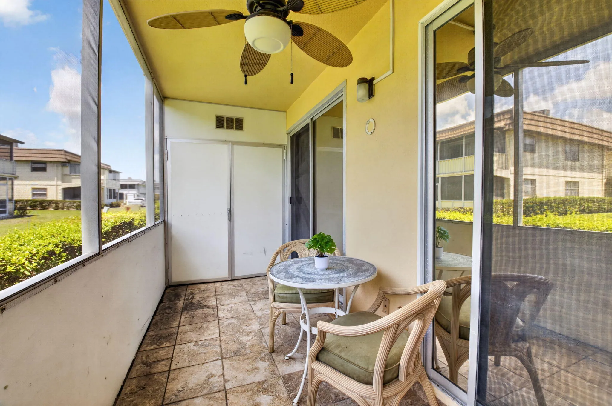 SCREENED PATIO WITH STORAGE CLOSET AS WELL AS WASHER/DRYER CLOSET