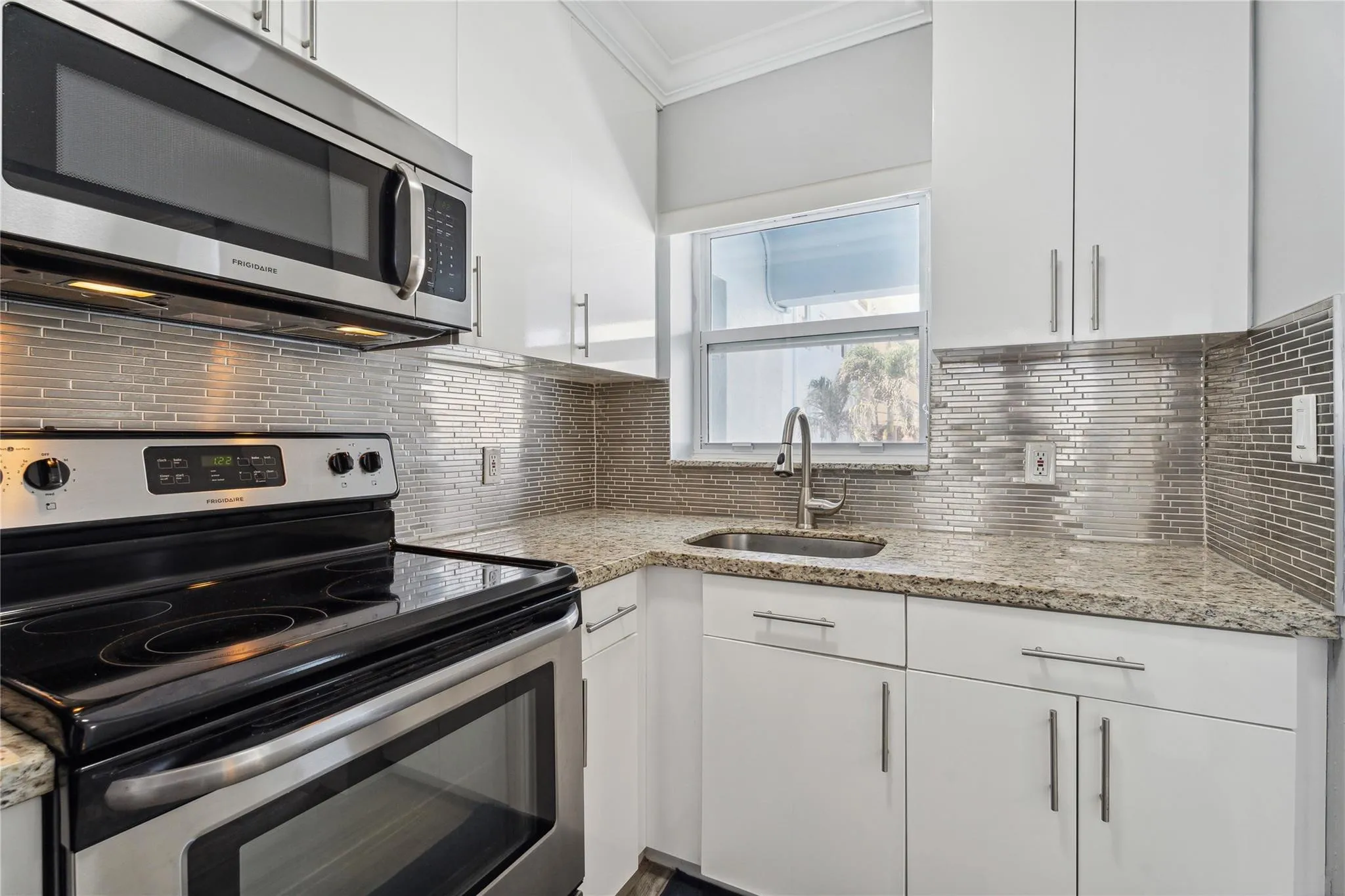 Granite kitchen with stainless appliances