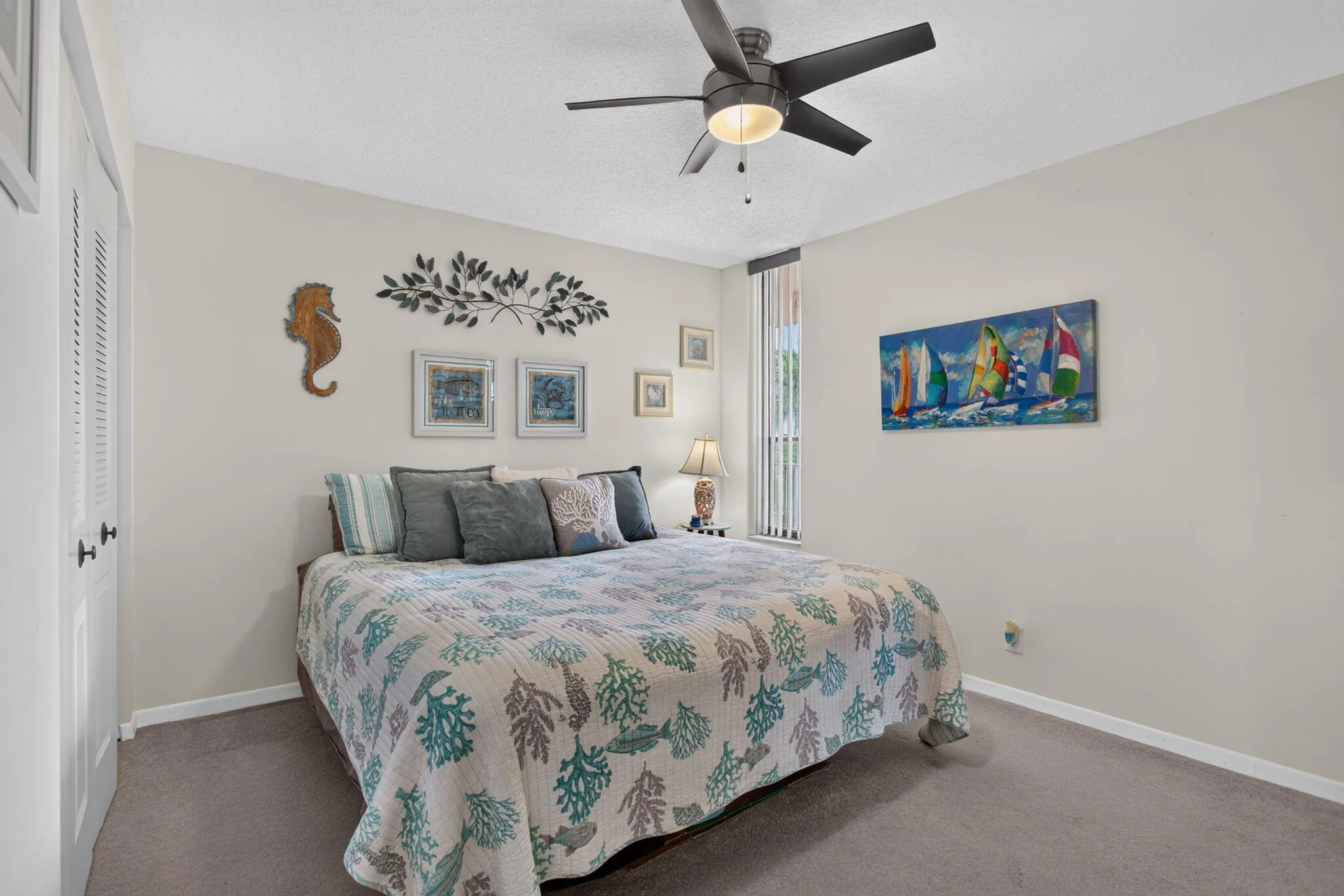Guests will love the pocket door for privacy in the large bedroom with plush carpeting.