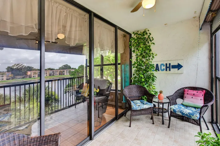 Sip your evening beverage and enjoy stunning sunsets on your screened balcony with sweeping lake views.