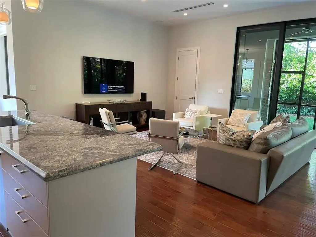 Family Room- 75" TV with Streaming Cable, Surround Sound, Apps.