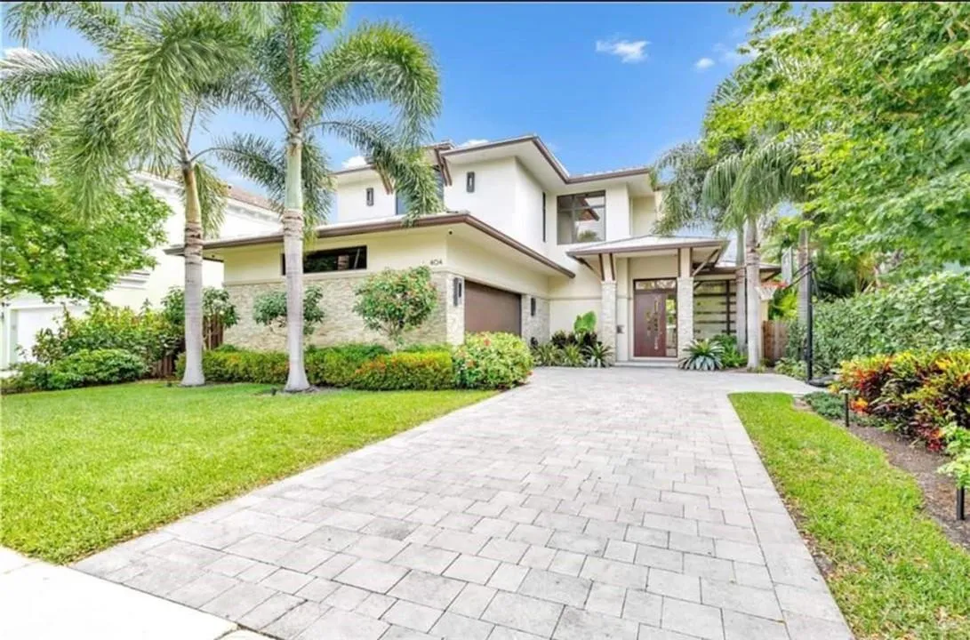 Front of HoFully appointed Luxury Vacation Home with Heated Pool in upscale Downtown Neighborhood walking distance to restaurants, pubs, shops & nightlife on Las Olas Blvd.e