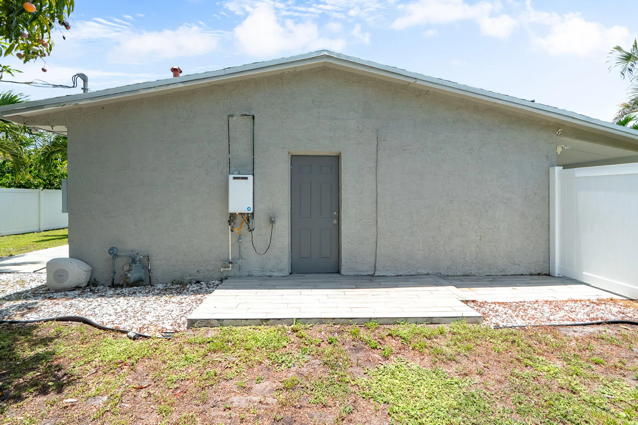 Side of house with side entrance and insta hot