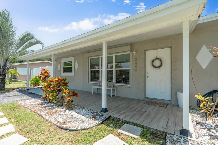 Front of house with full porch