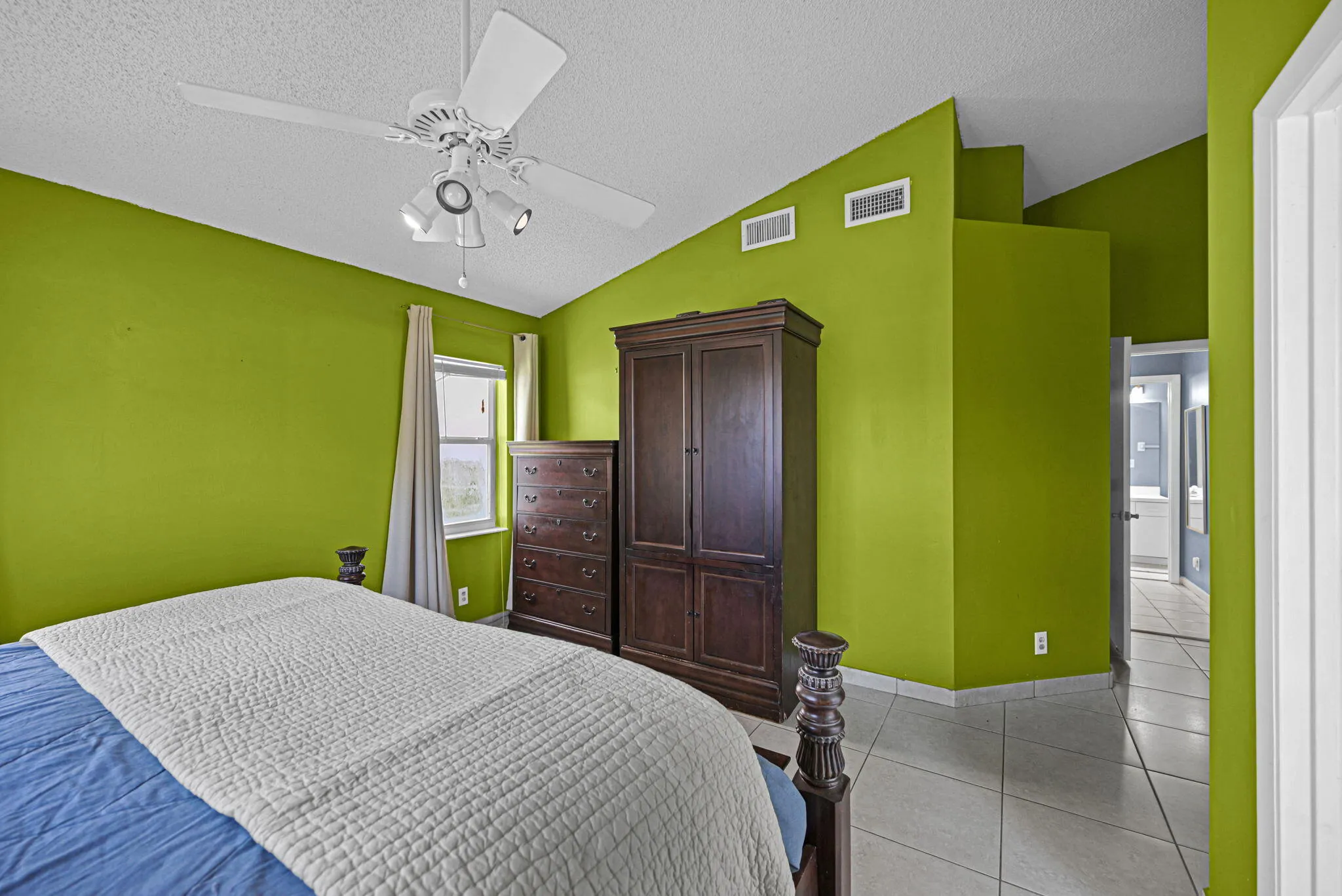 Vaulted ceilings featuring a white ceiling fan with integrated lighting