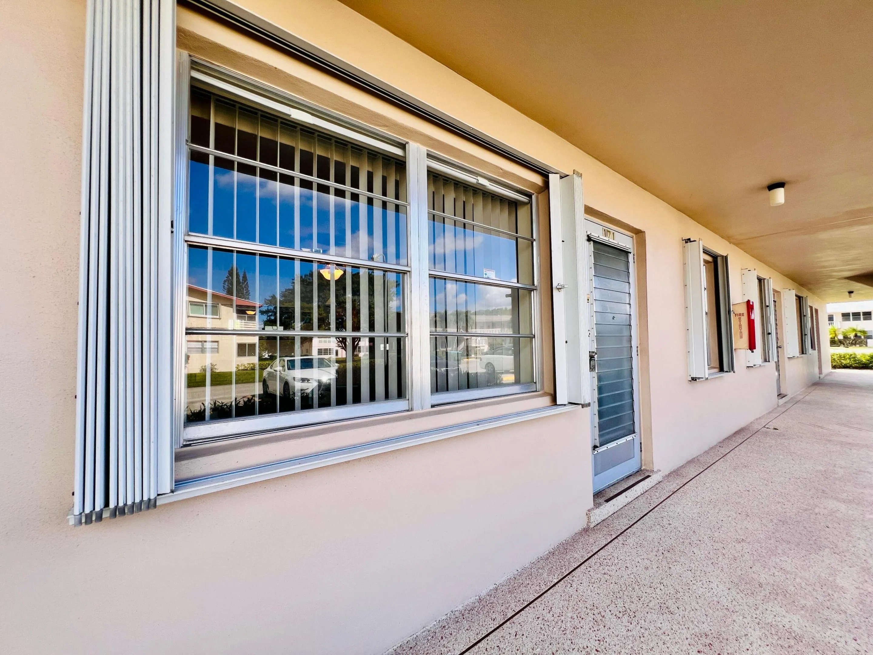A Terrific Spot to Call Home In Century Village: First Floor, Water Views, New Roof 2023, New AC 2023, Accordion Shutters Front & Back