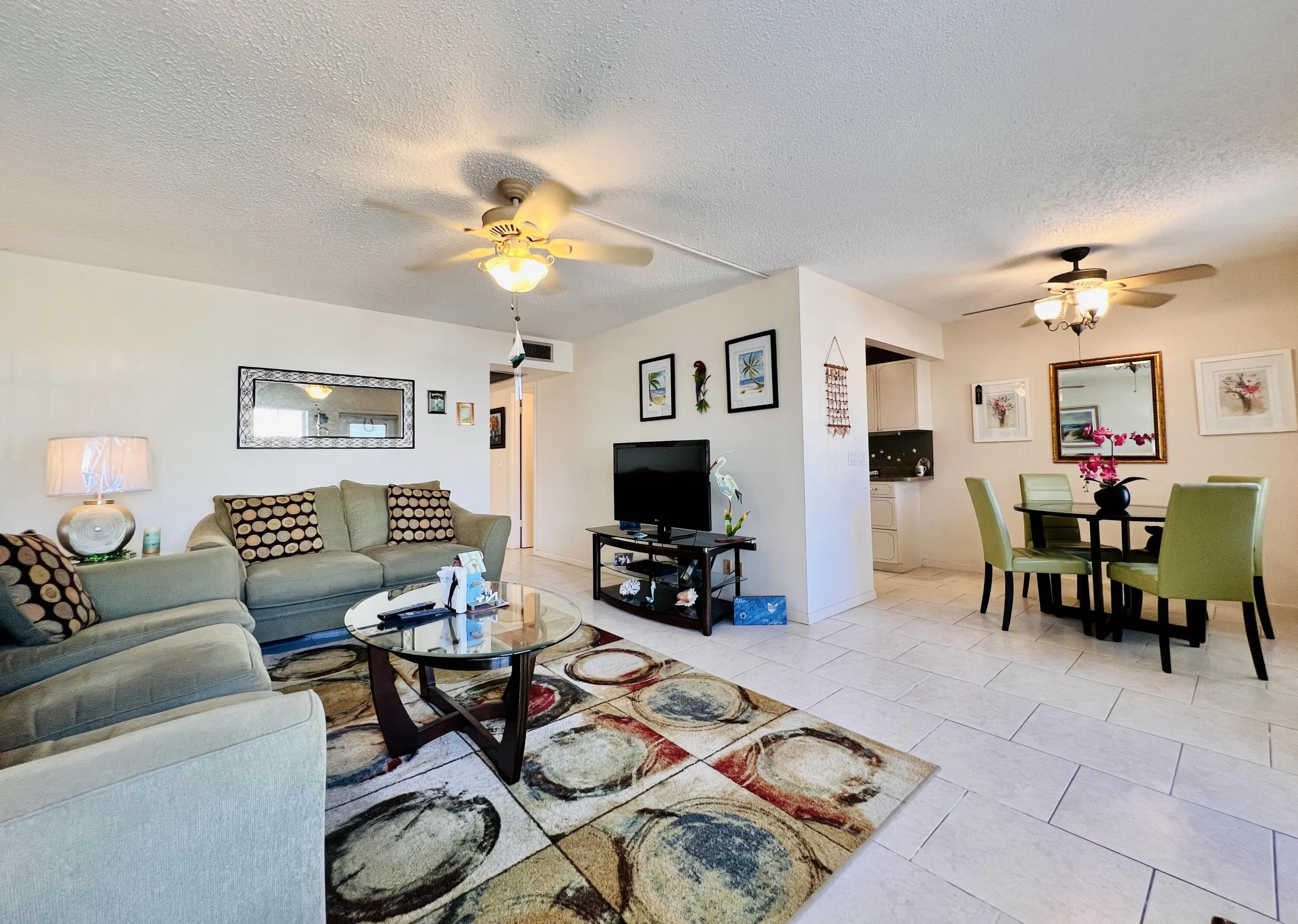 Neutral Tile Flooring Flows Throughout. Sold Furnished