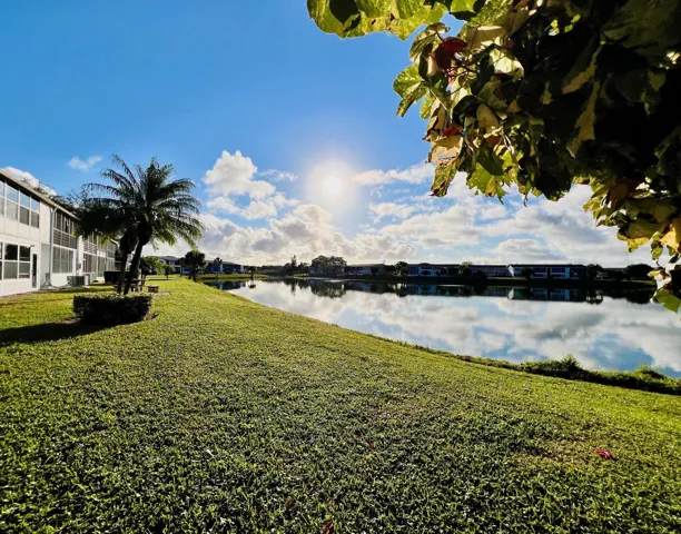 Gorgeous WATER VIEWS! Lovely FIRST FLOOR 2/1.5 Century Village Condo in the Desirable Chatham Section