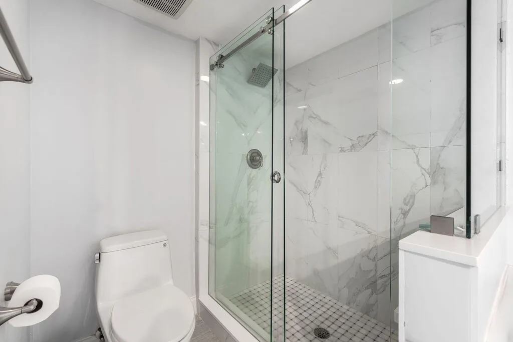 primary bathroom shower with separate tub