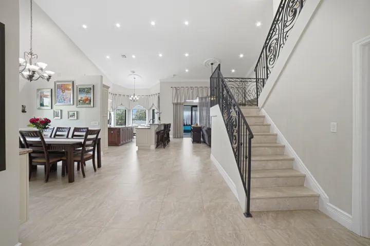 Grandiose staircase featuring ornate wrought iron railing