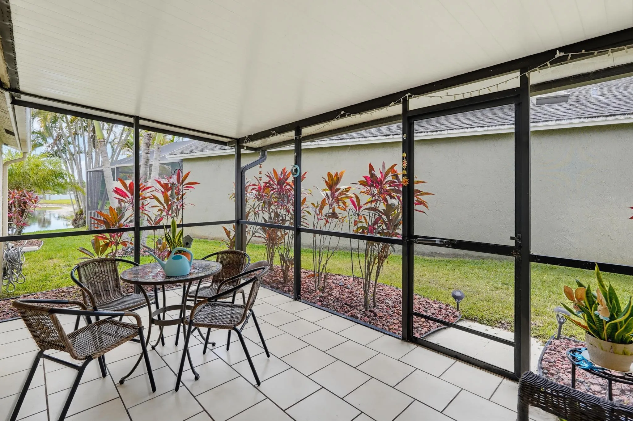Tiled patio with double sliding doors to kitchen