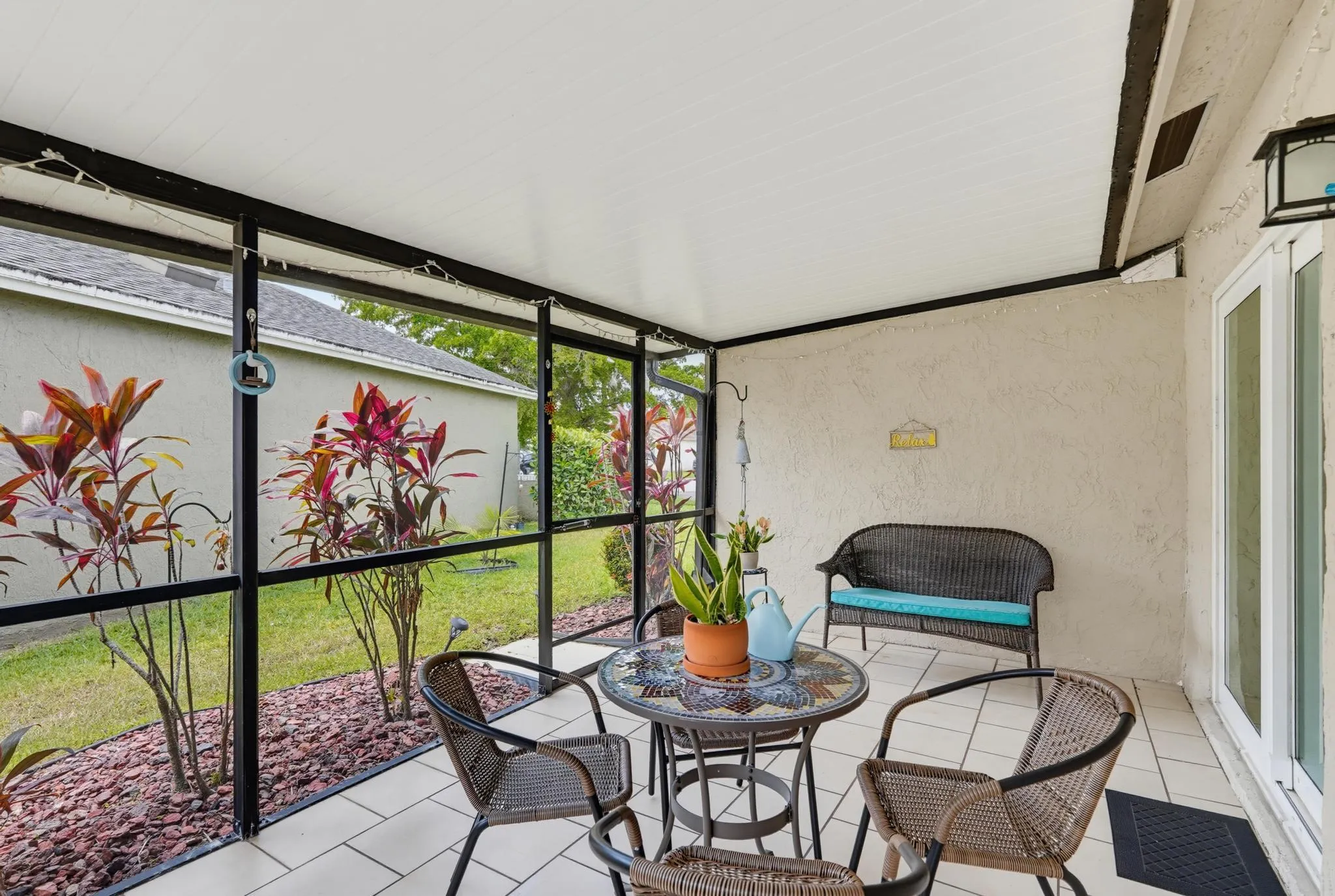 Screen door opens to side yard
