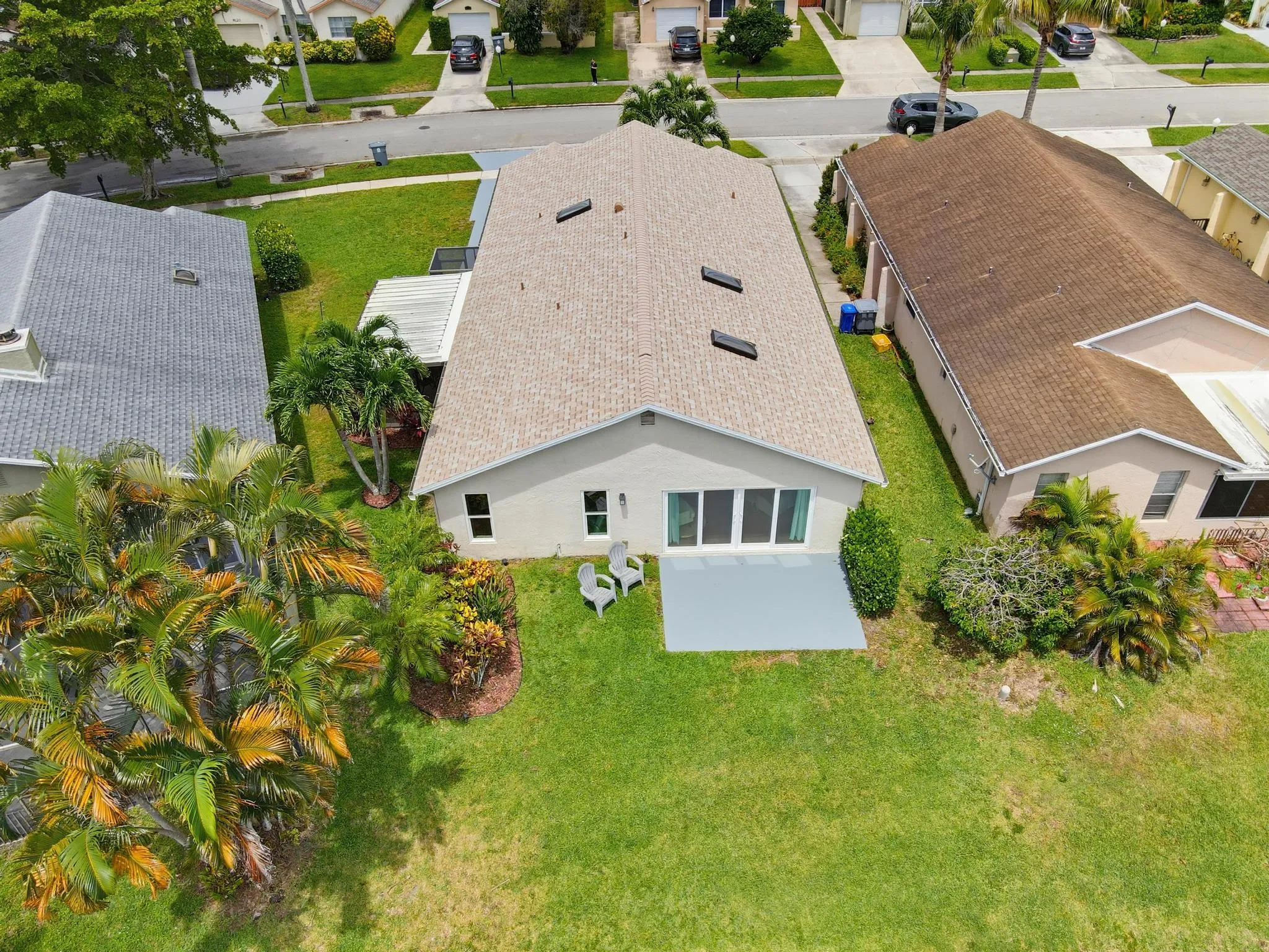 Private rear yard with outdoor patio and screened and covered porch
