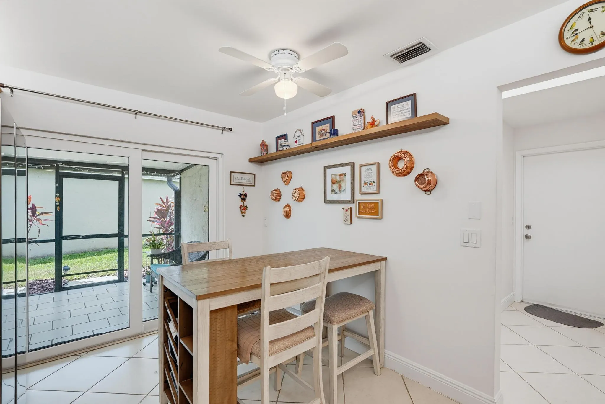 Eat-in area ceramic tiled floor and ceiling fan with light