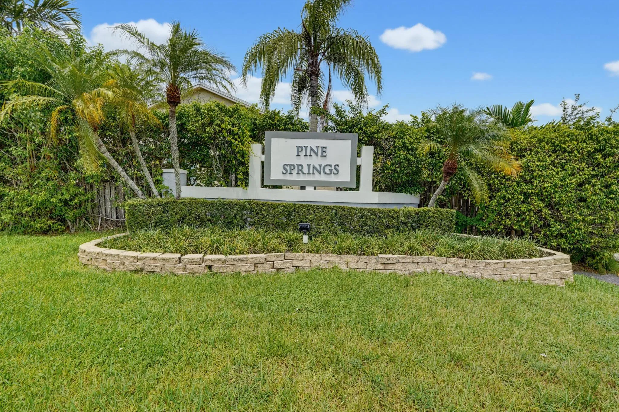 The community grounds community center and entry are maintained by the Pine Springs HOA