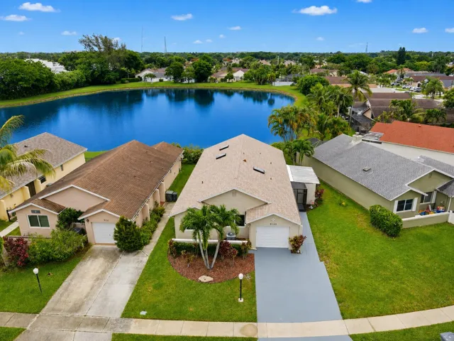 Beautiful lake view looking east from backyard. Room to park a boat!