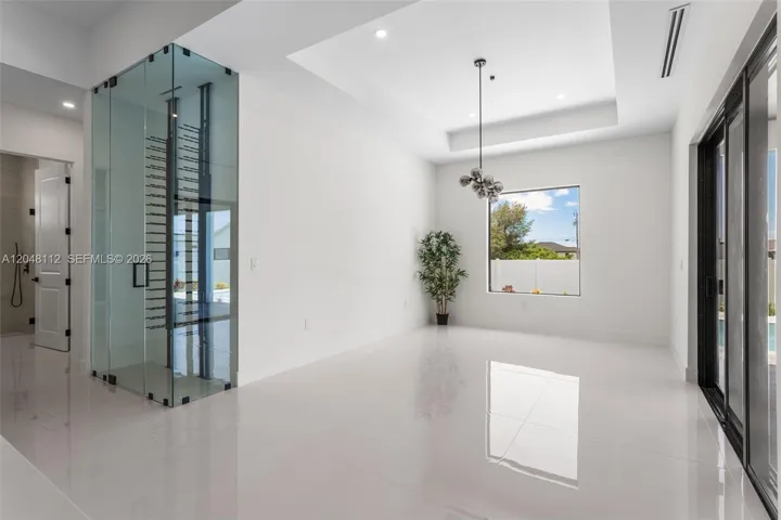 Formal Dining Room with Big Picture Window and Chandelier