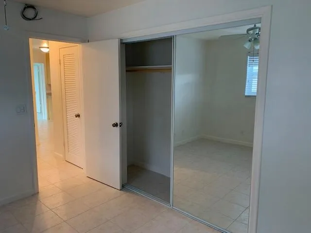 Neutral-toned tile flooring throughout