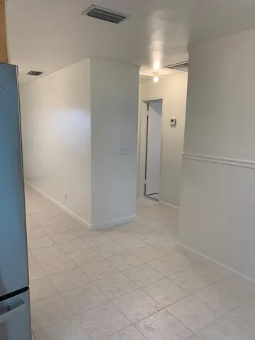 Neutral-toned tile flooring throughout