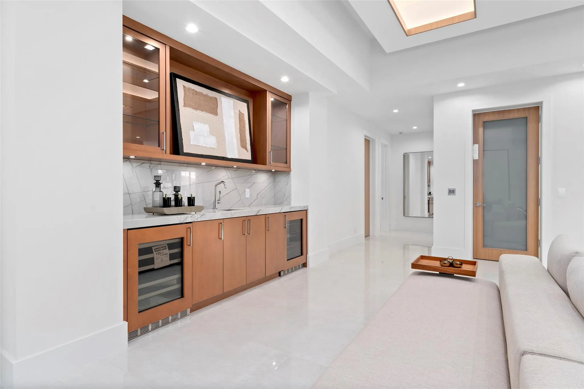 Second-Floor Sitting Area with Wet Bar and Wine Cooler – Perfect for Entertaining