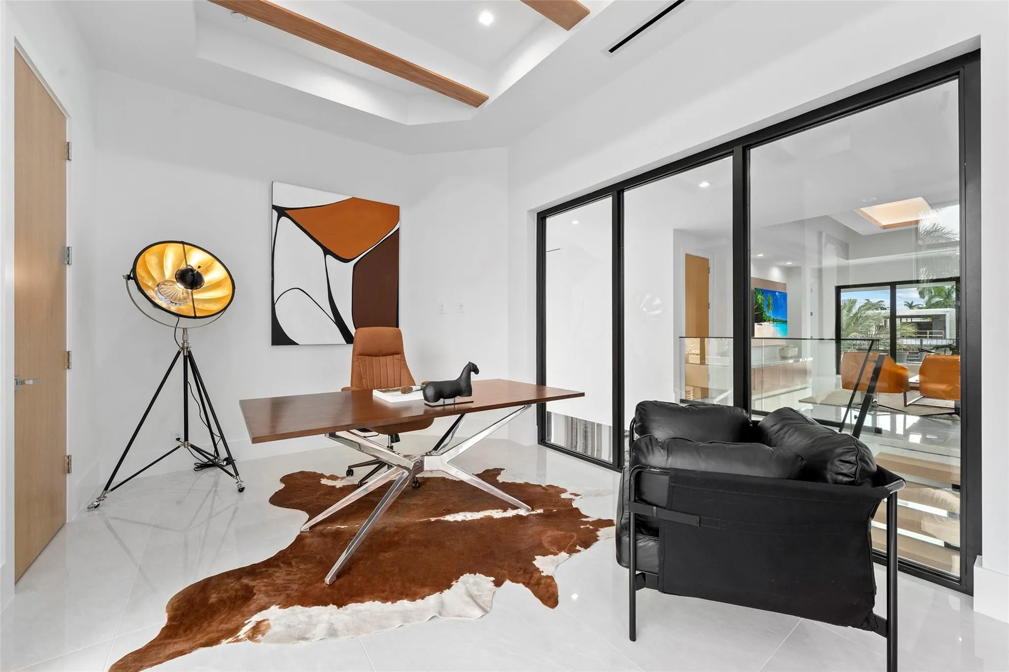 Fourth Bedroom with Striking Glass Wall Overlooking the Second-Floor Interior