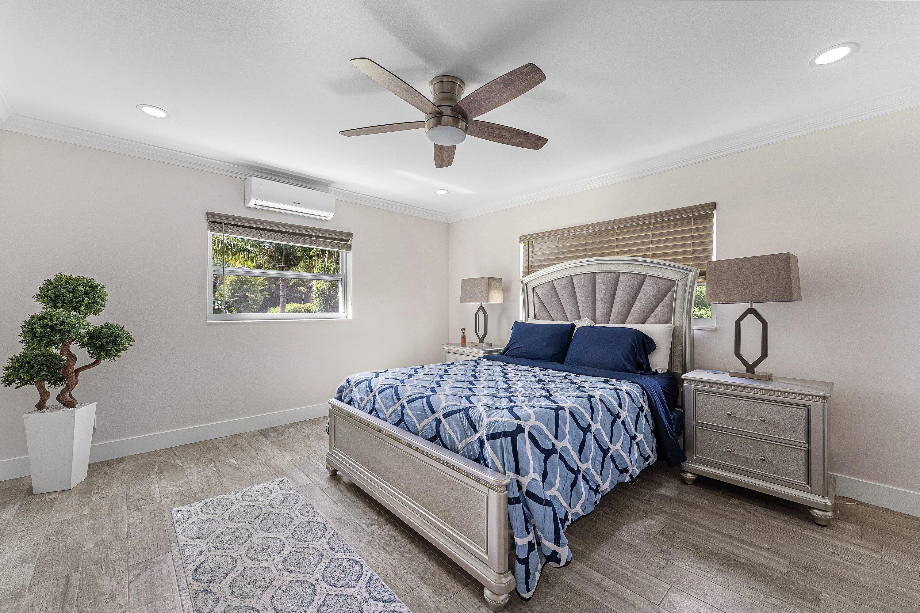 Bedroom featuring wood-finish flooring, recessed lighting, and crown molding