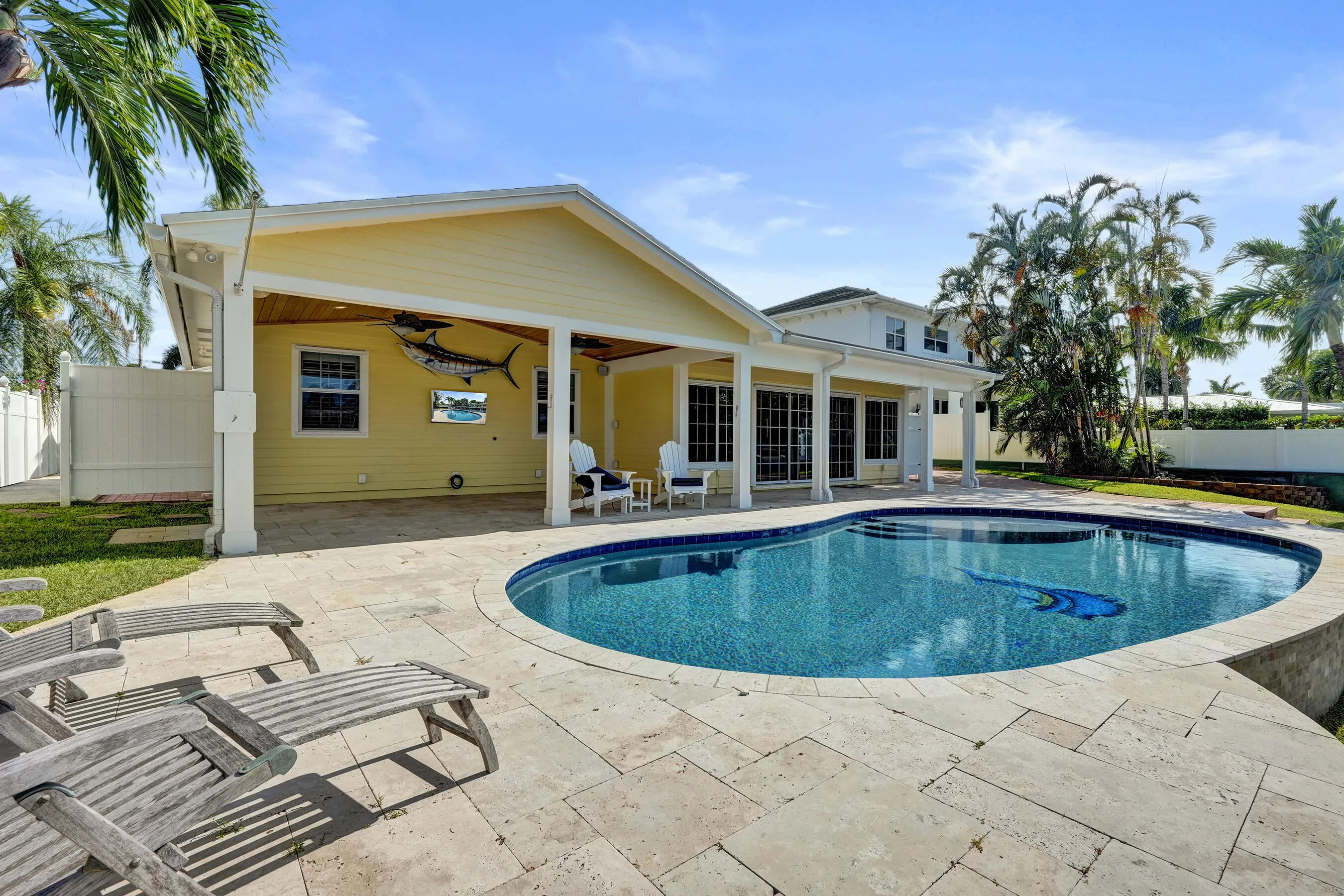 Beautiful travertine stone pool deck.