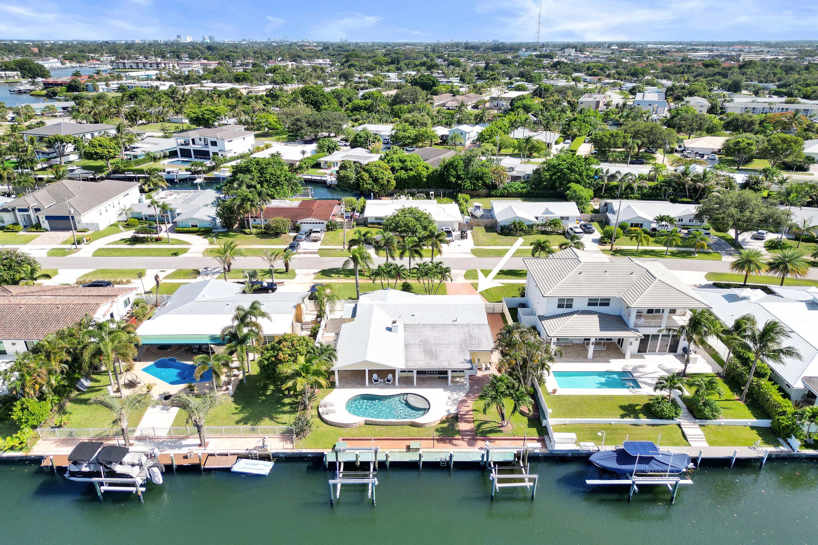 Waterfront pool home with 2 boat lifts.
