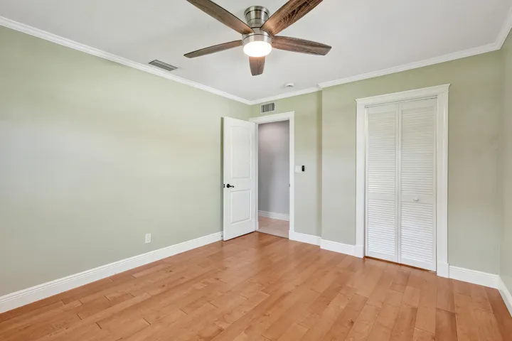 Corner bedroom features a walk-in closet. Solid core designer interior doors were installed in 2013.
