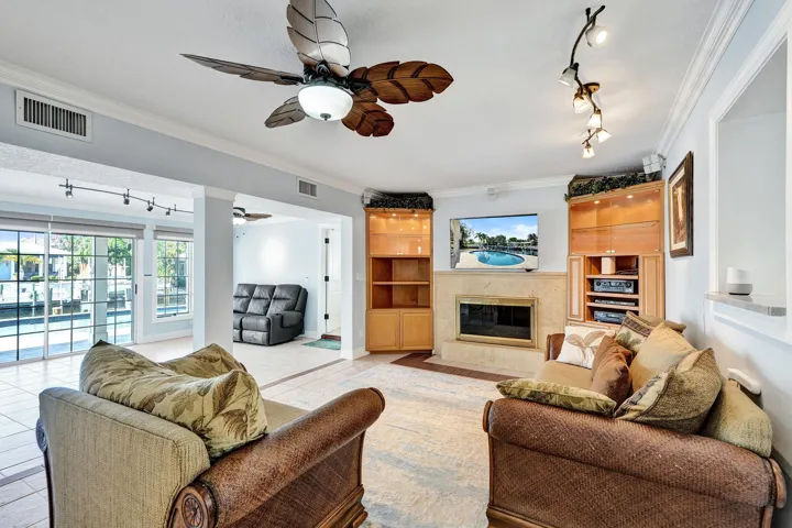 There's so much natural light in this home. You'll find yourself wanting to spend most of your time in this oversized 25'10 x 27' room. This area of the home is so spacious, but is still cozy, with a gas fireplace and brick chimney. Surrounding the fireplace are custom maple built-in cabinets.