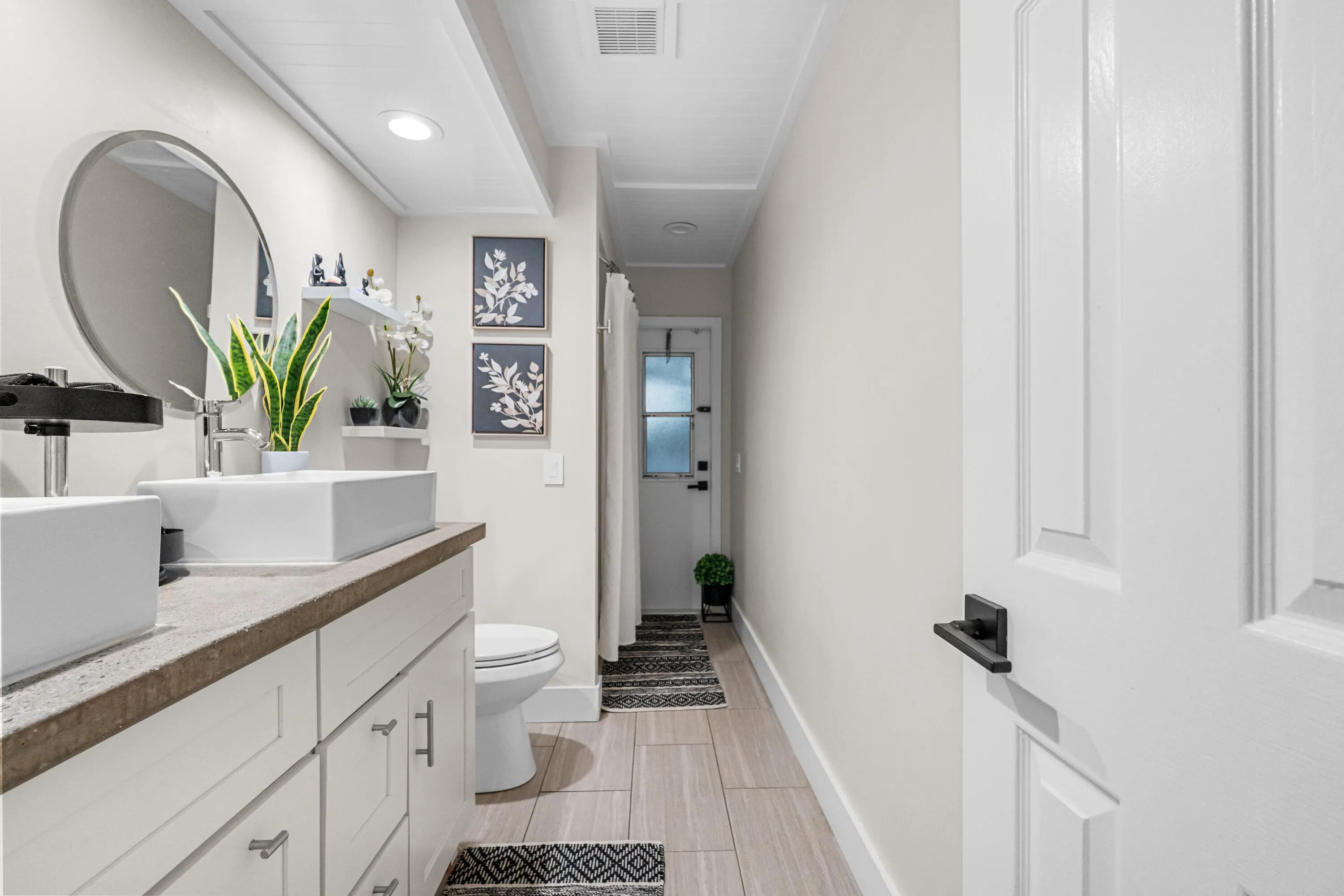 Guest bathroom with access to covered patio.