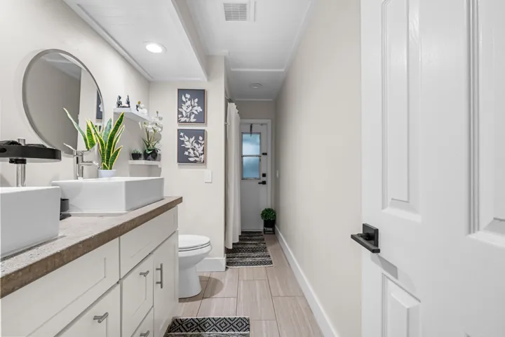 Guest bathroom with access to covered patio.
