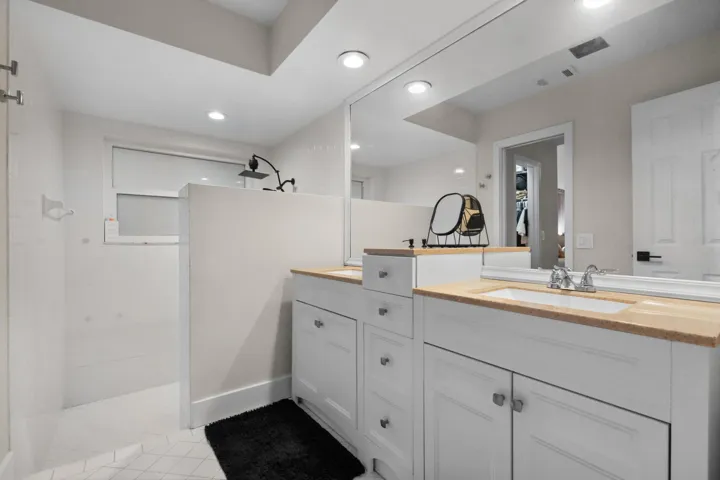 Primary bathroom with access to pool area.