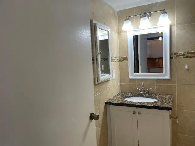 WITH TILE FLOOR TO CEILING