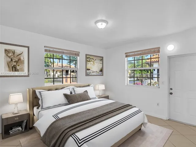 Bedroom # 2 with private entrance and bathroom. Virtually Staged Photo.