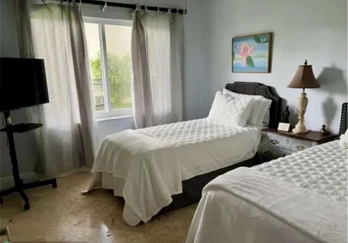 Light-colored wall paint paired with patterned flooring