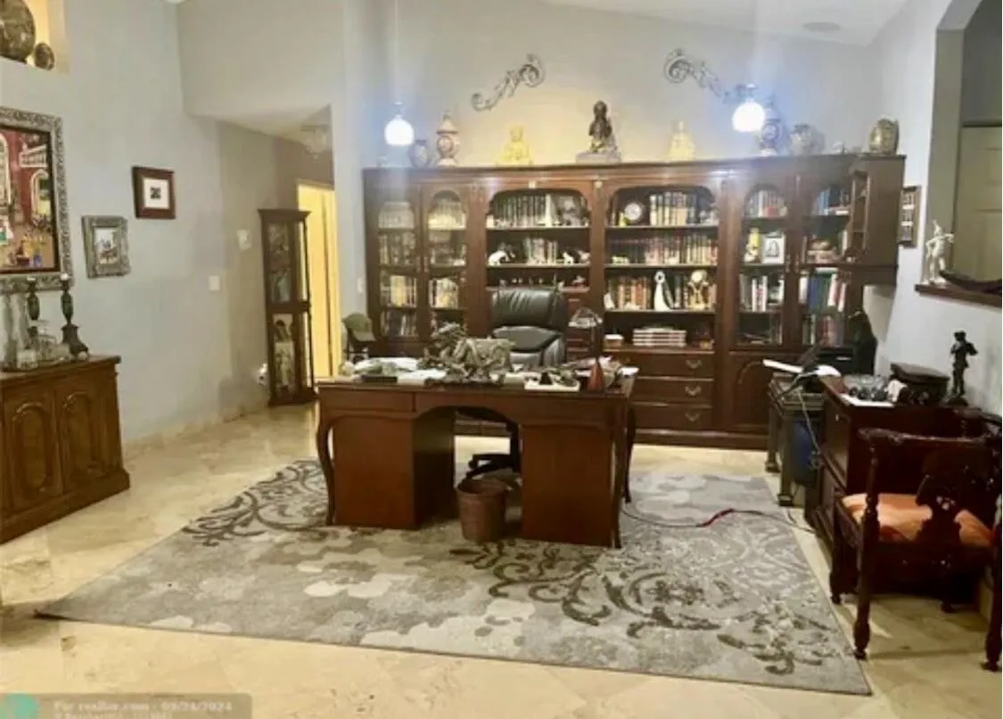Spacious interior featuring vaulted ceilings and polished stone-finish flooring