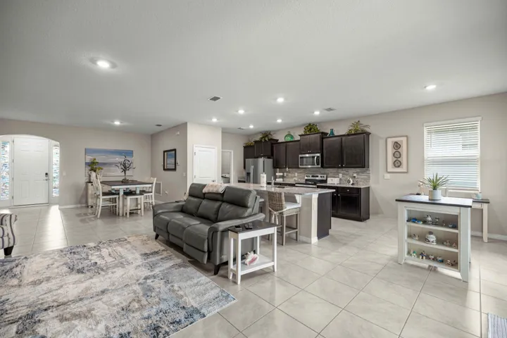 Open concept living area featuring tile flooring throughout