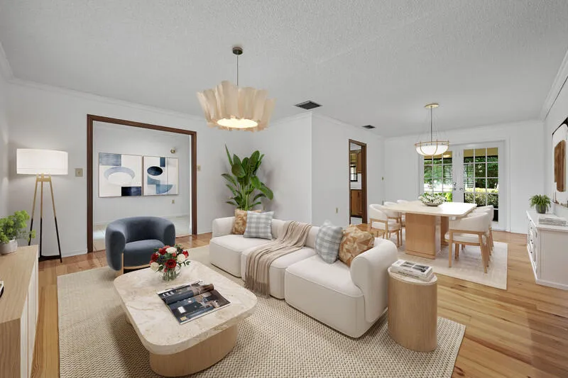 Virtually furnished Living/Dining with open, front to back floor plan. French doors at back of Dining area.