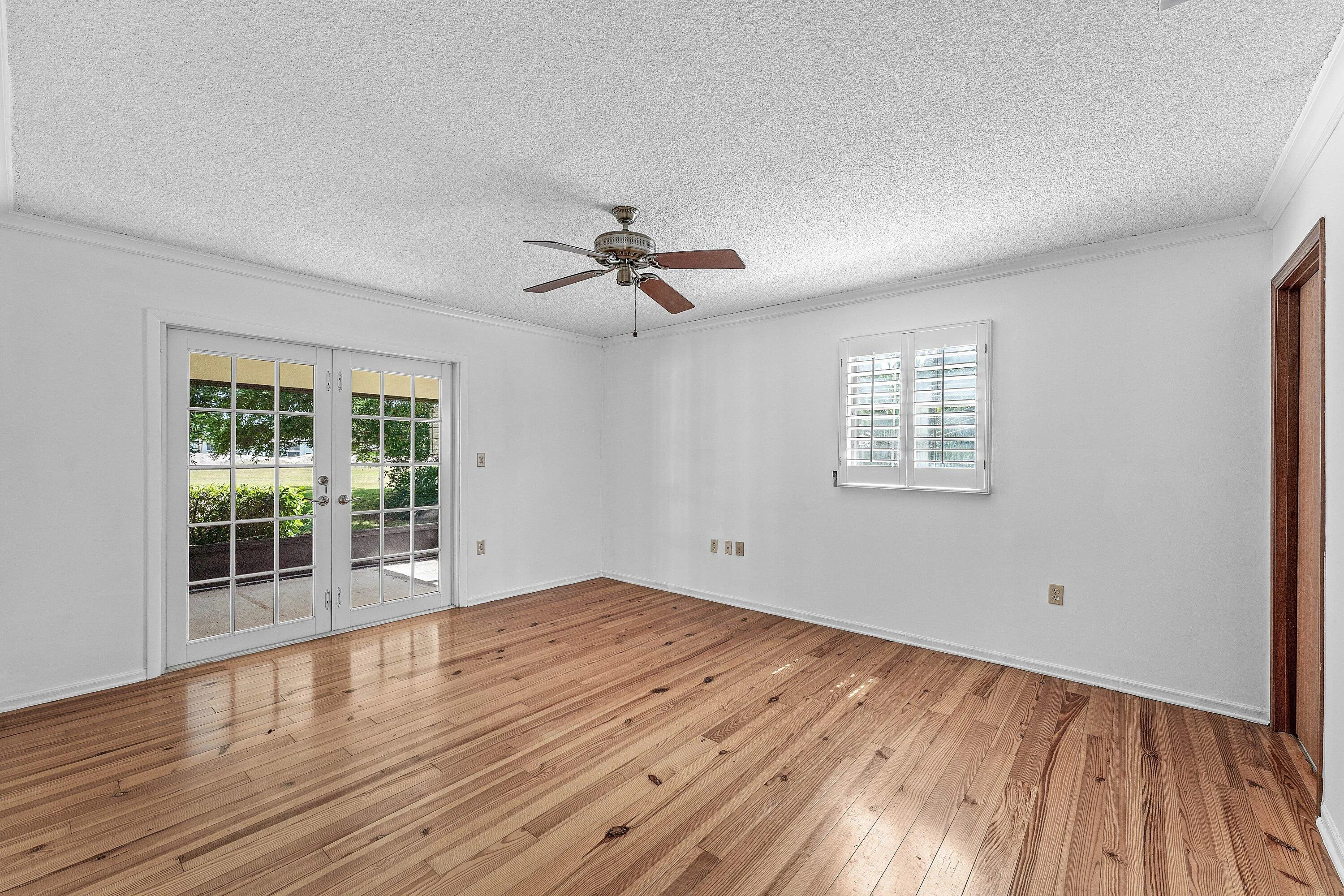French doors provide streaming light and views to the outdoors.
