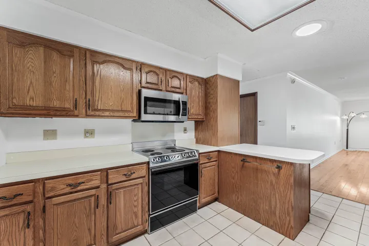 Kitchen provides lots of counter space and ample storage.