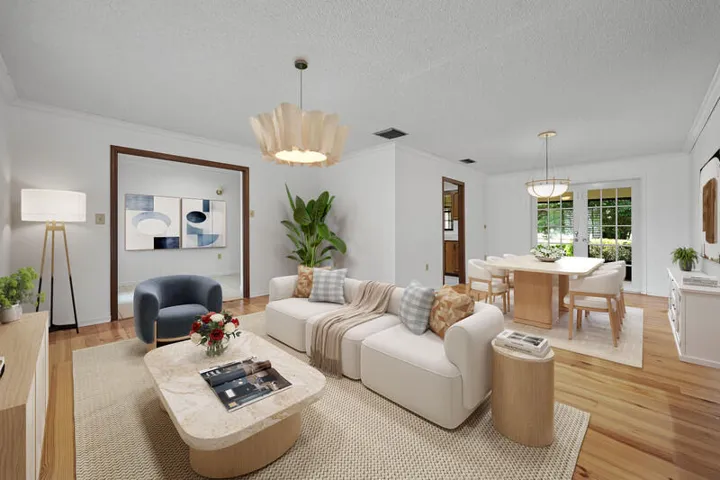 Virtually furnished Living/Dining with open, front to back floor plan. French doors at back of Dining area.