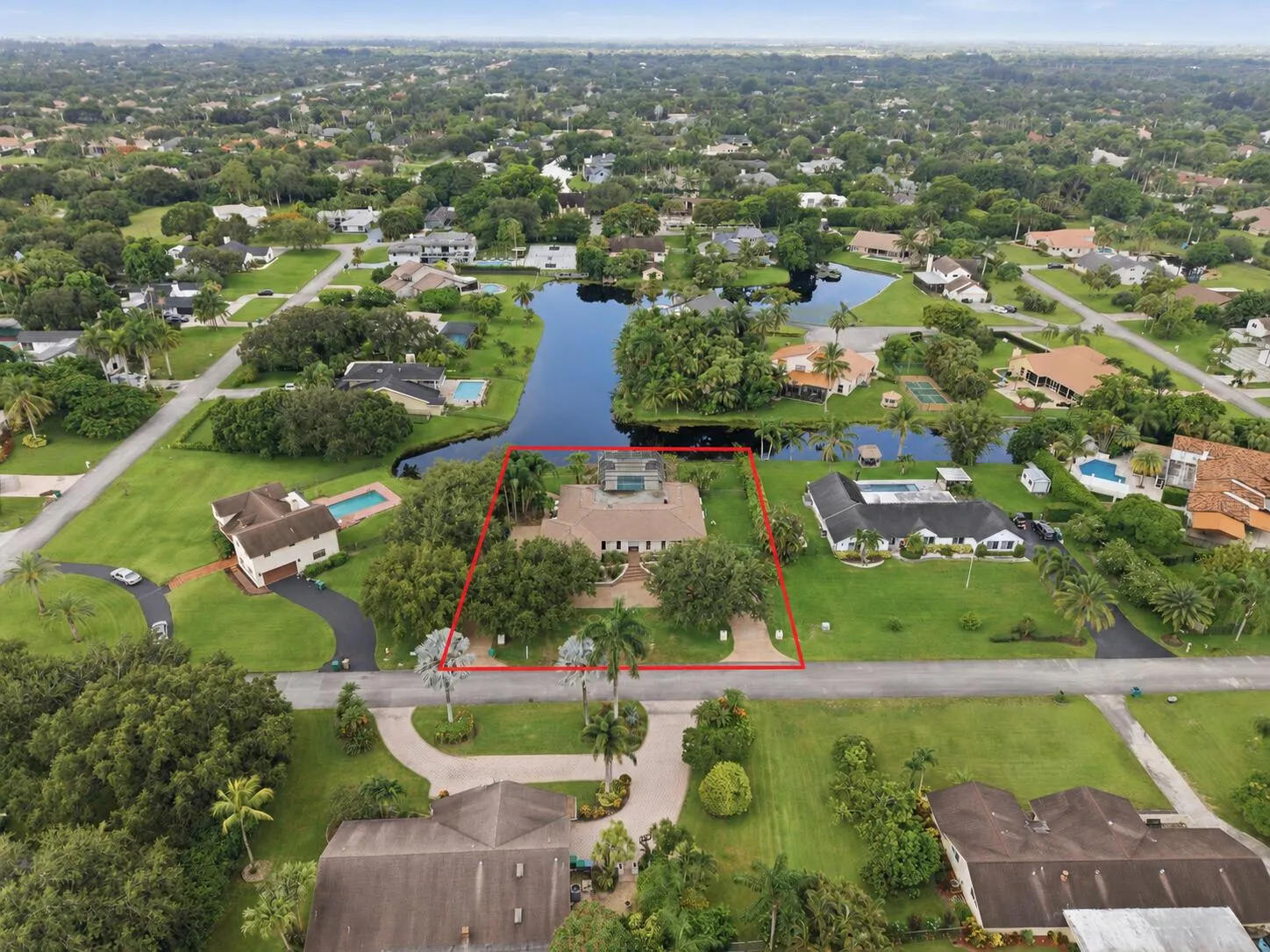 Aerial perspective showcasing a property with a prominent water frontage