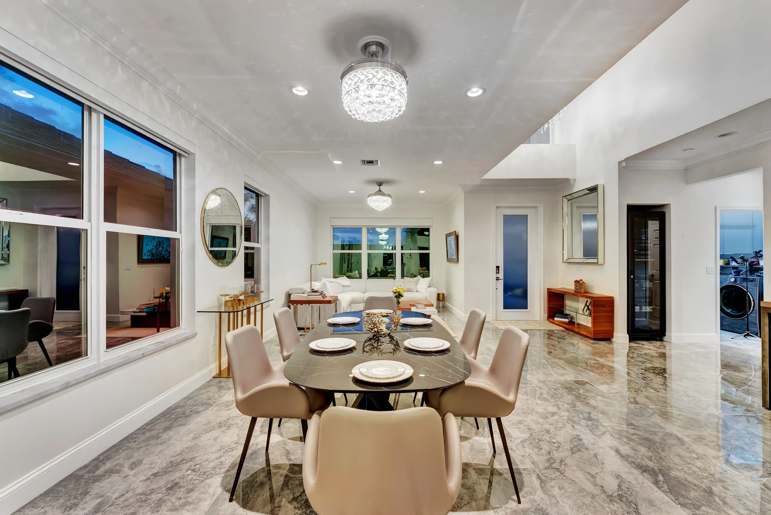 Dining room styled for entertaining, shown in warm evening light.