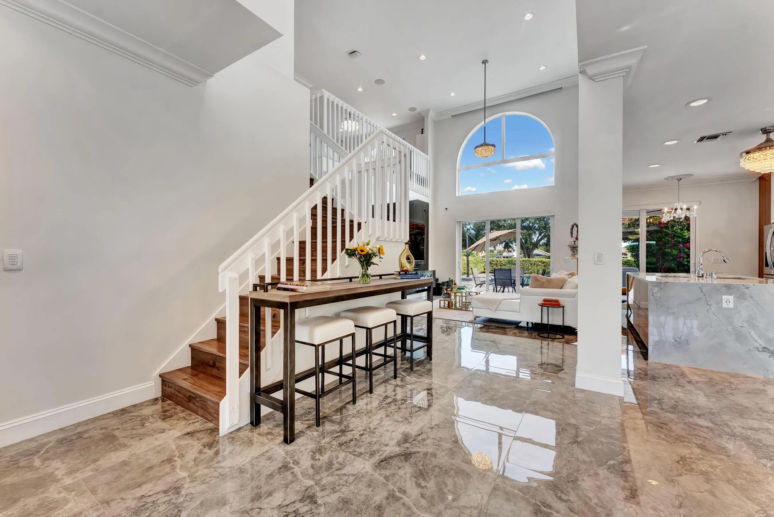 Breakfast bar seating at the base of the staircase, steps from the kitchen and great room.