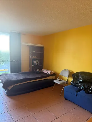 Spacious Master bedroom with a garden view.