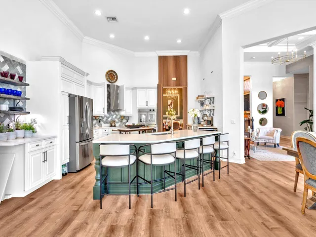 SUCH A BEAUTIFUL KITCHEN WITH QUARTZ COUNTERTOPS AND EAT-AT CENTER ISLAND
