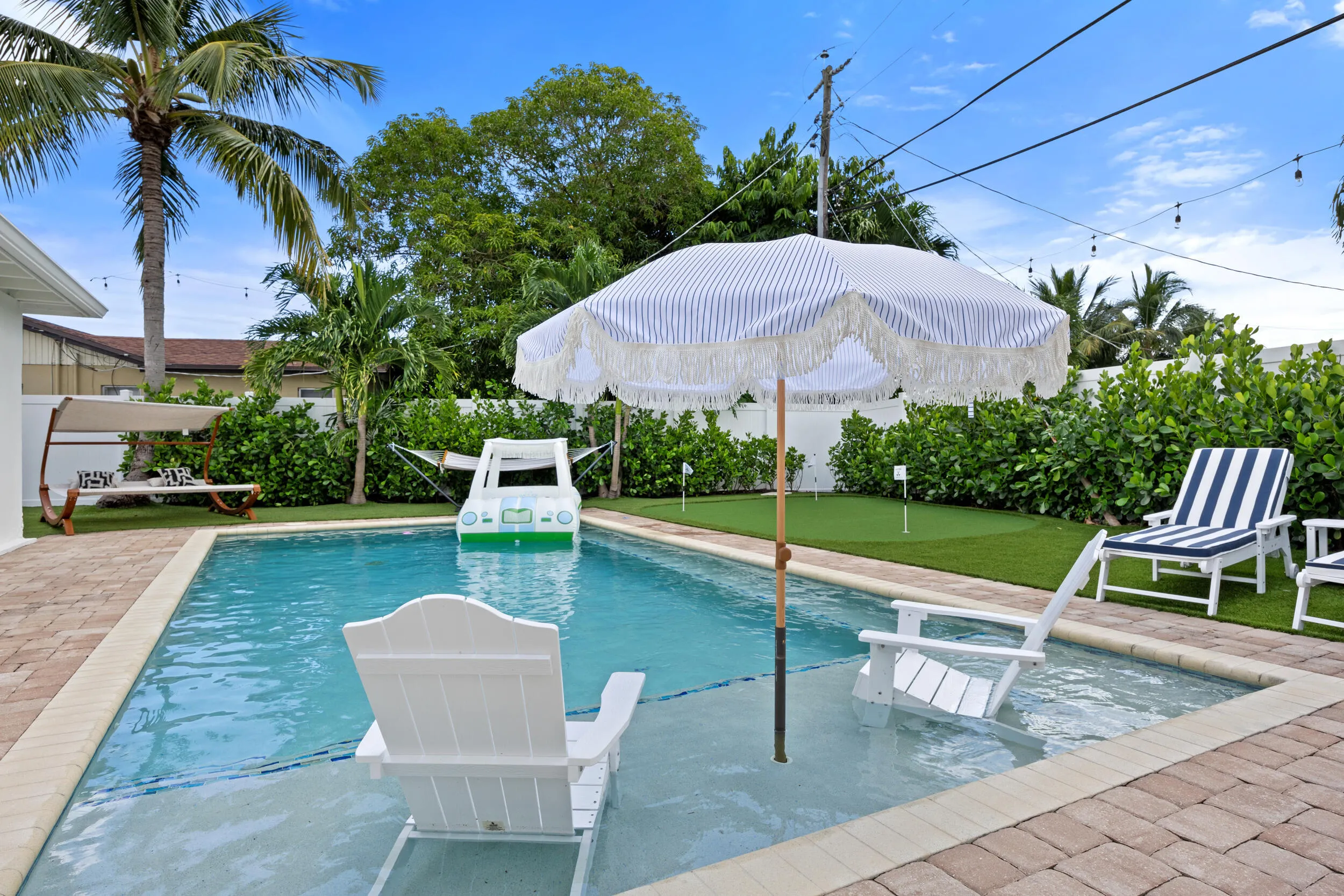 Heated saltwater pool with sun shelf.