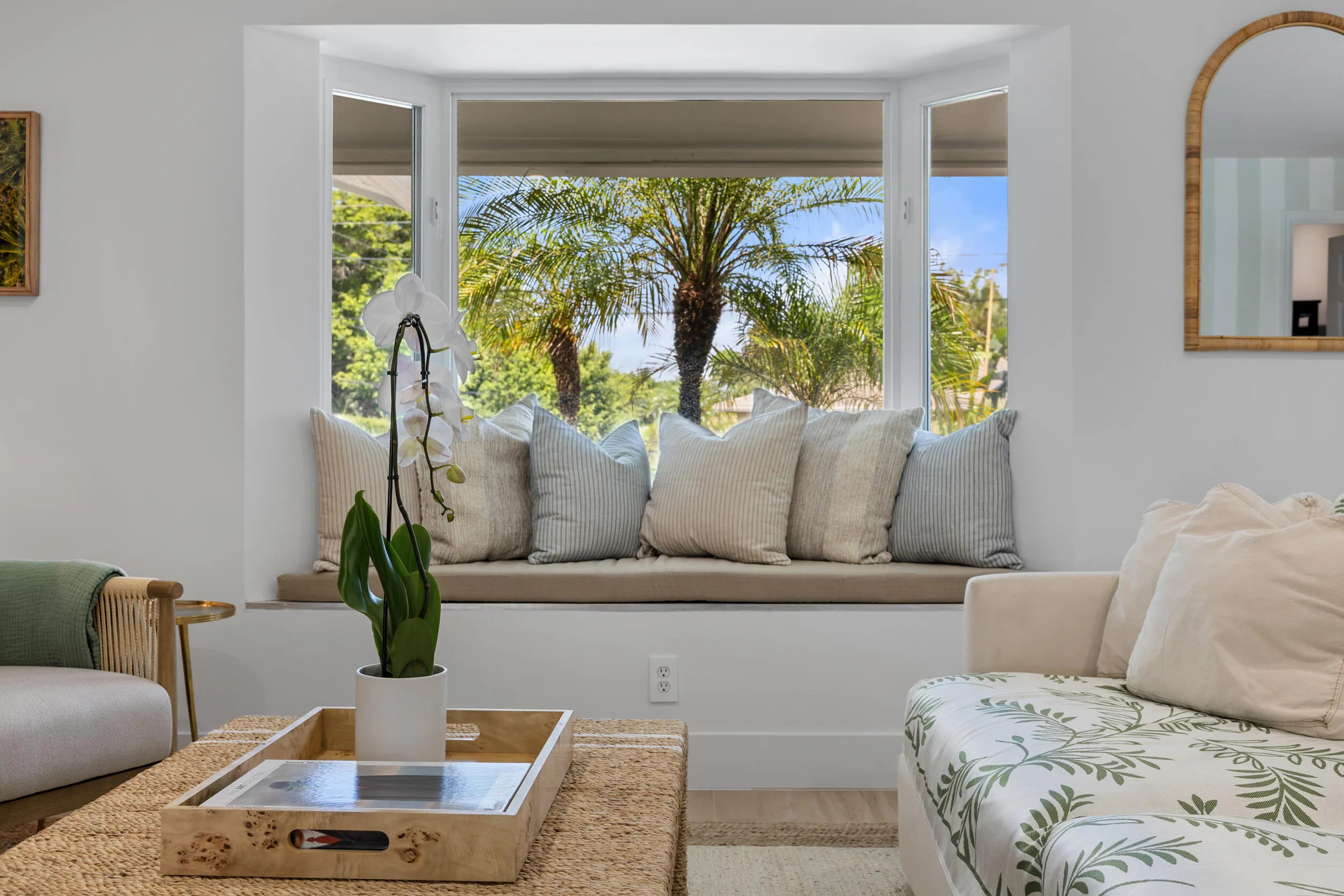 Couch, chairs, reading nook. Large smart TV.