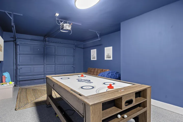 Pool, air hockey, ping pong table. Split AC unit. Couch, bean bag, large smart TV.